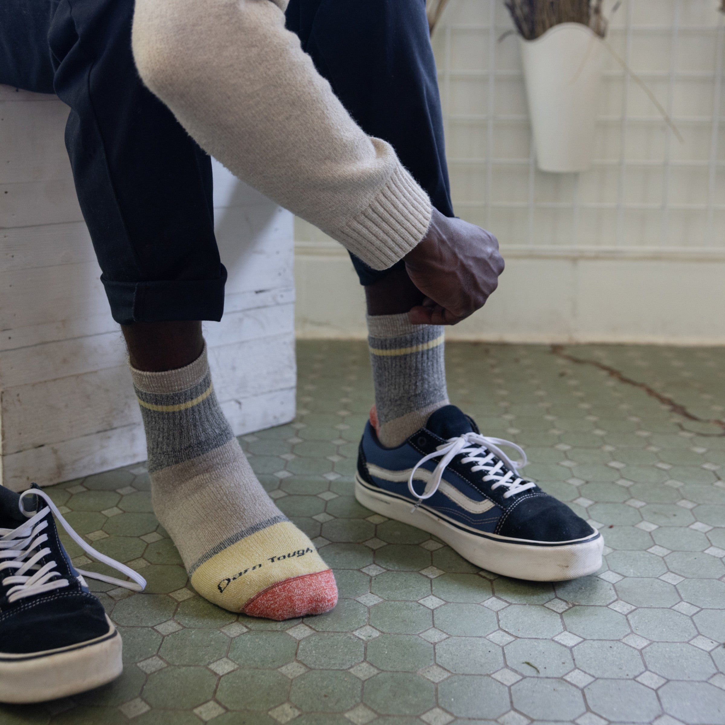 Close up of model putting on shoes wearing the 6118 Rye