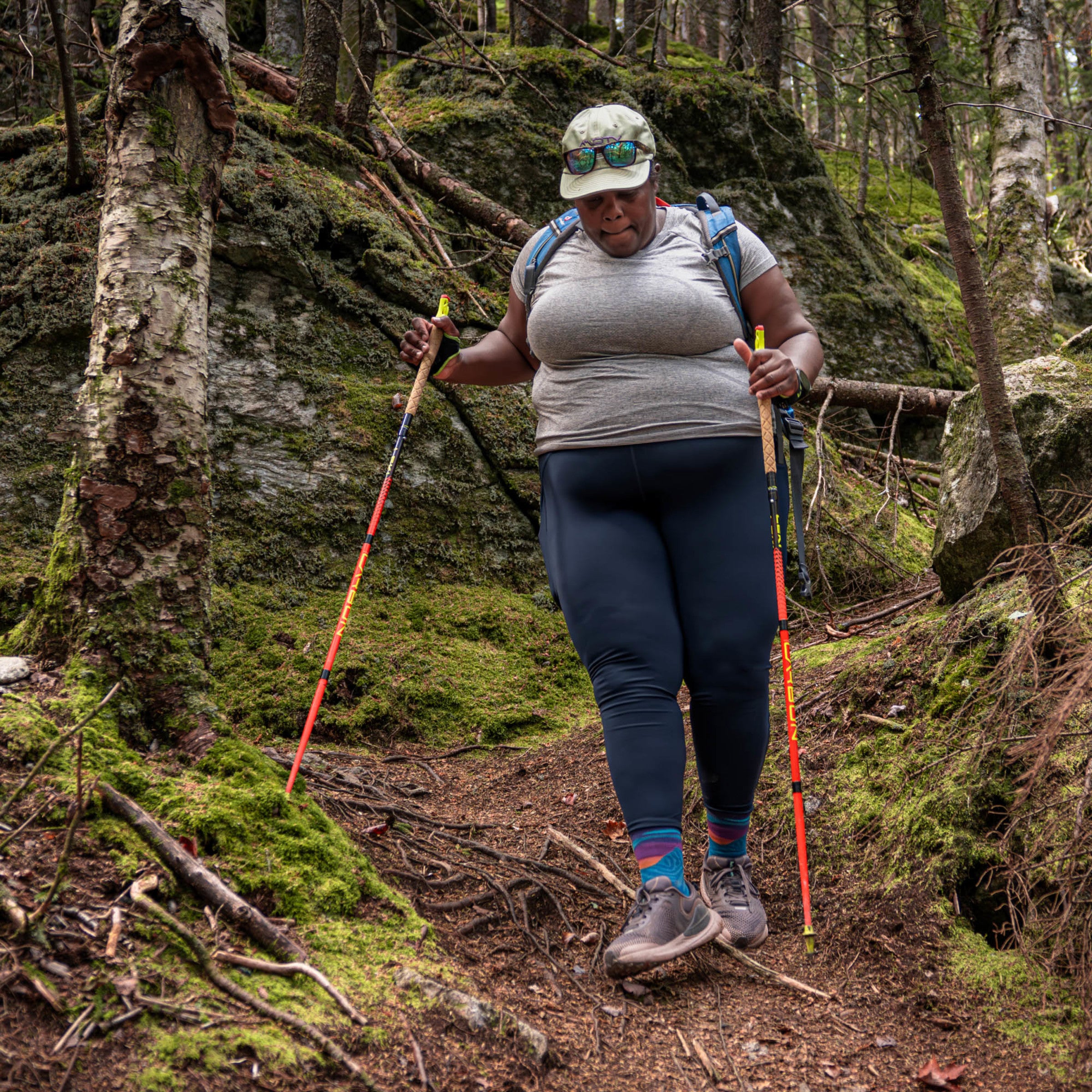Mirna Hiking in the woods wearing the 1067 Mirnavated micro crew running sock in cascade
