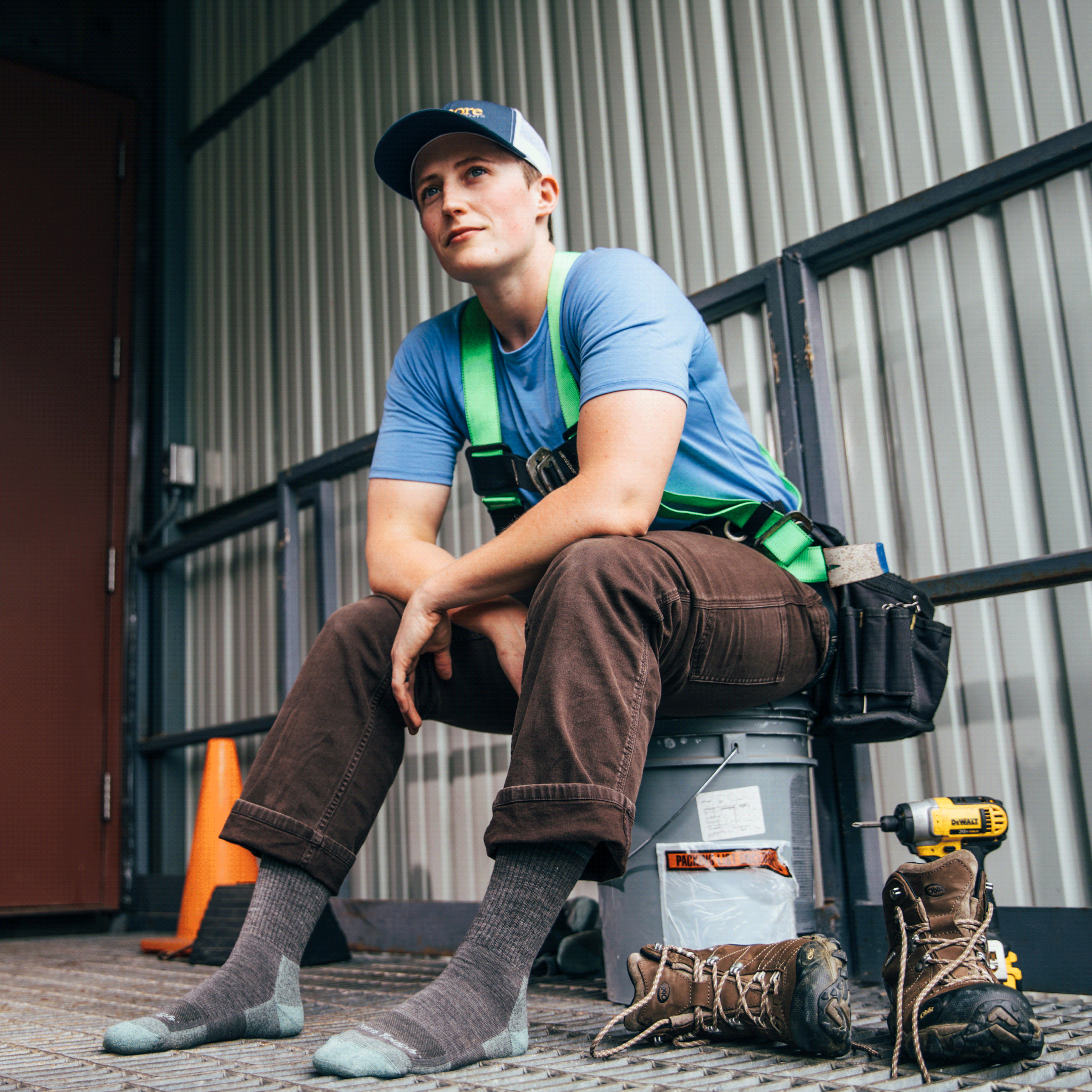 Worker taking a break, showing off RTR work boot socks in shale