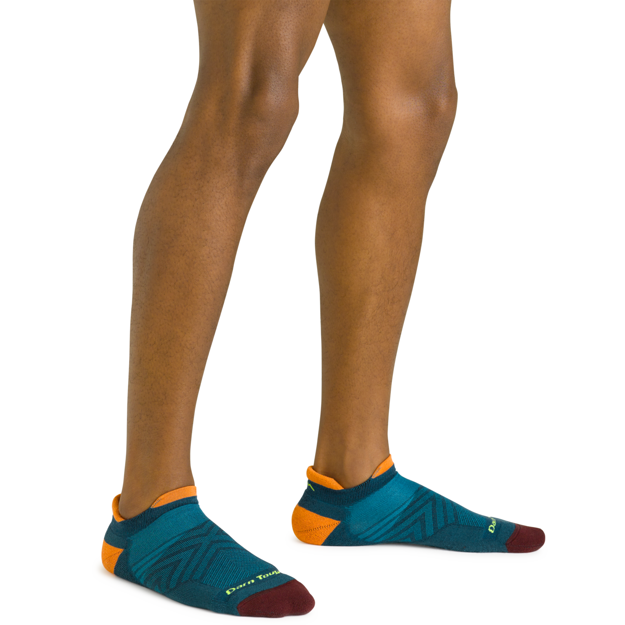 Close up shot of model wearing the men's no show tab running sock in dark teal with no shoes on
