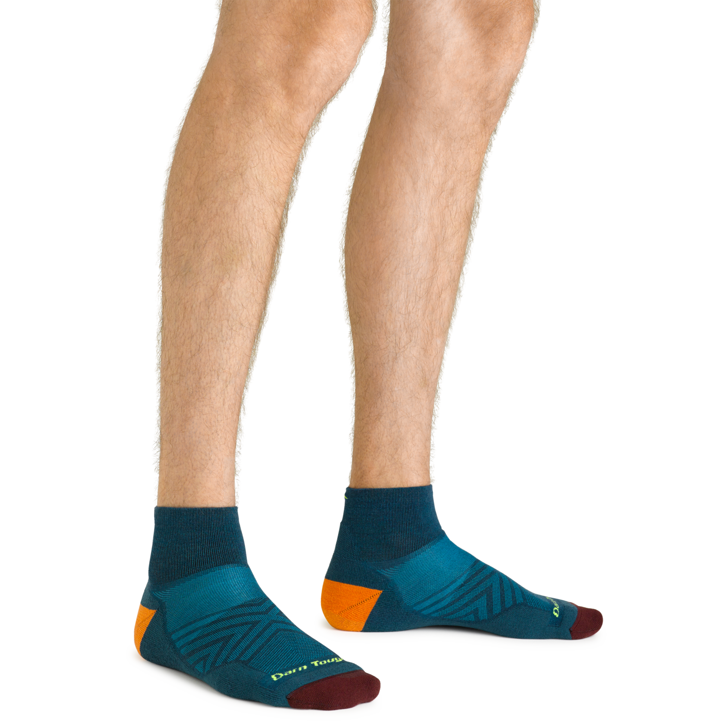 Close up shot of model wearing the men's quarter running sock in dark teal with no shoes on
