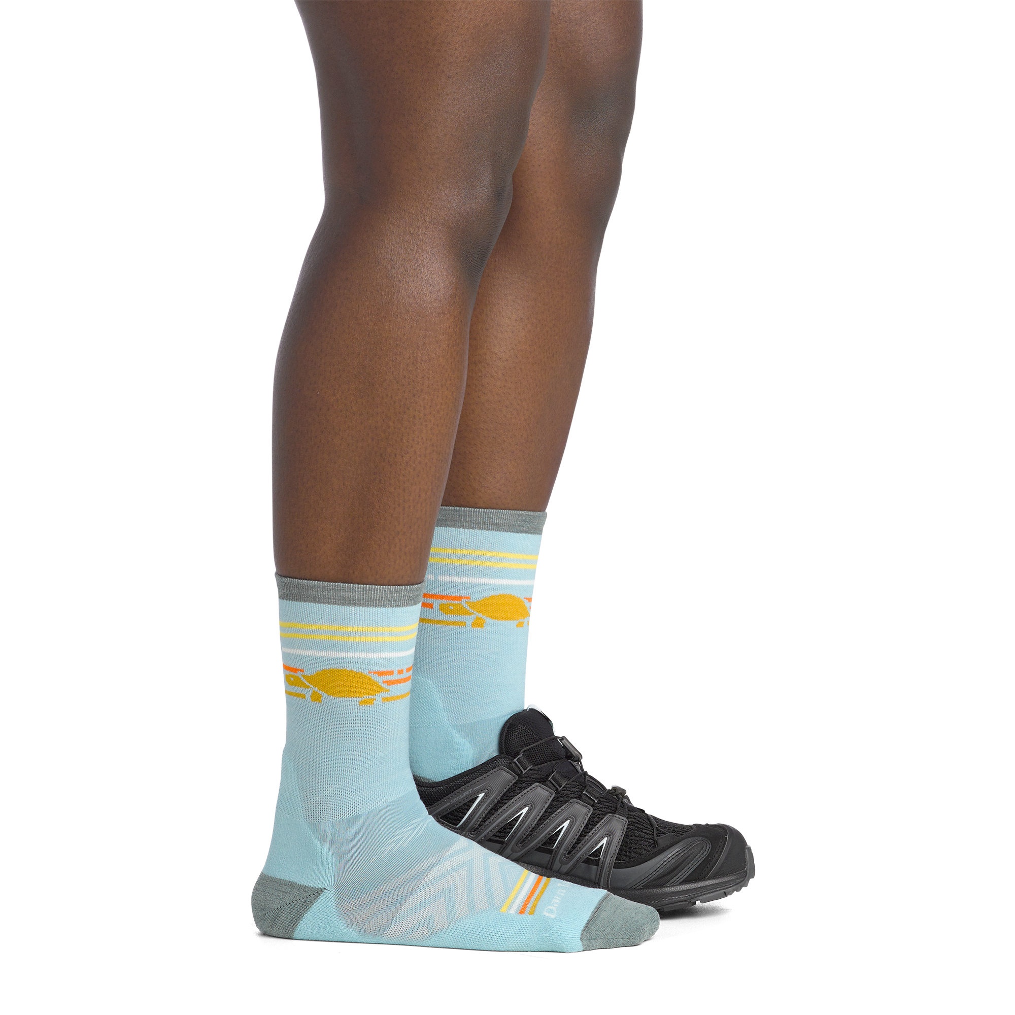 on model image side view with back foot in a shoe of the 1050 pacer micro crew in glacier colorway
