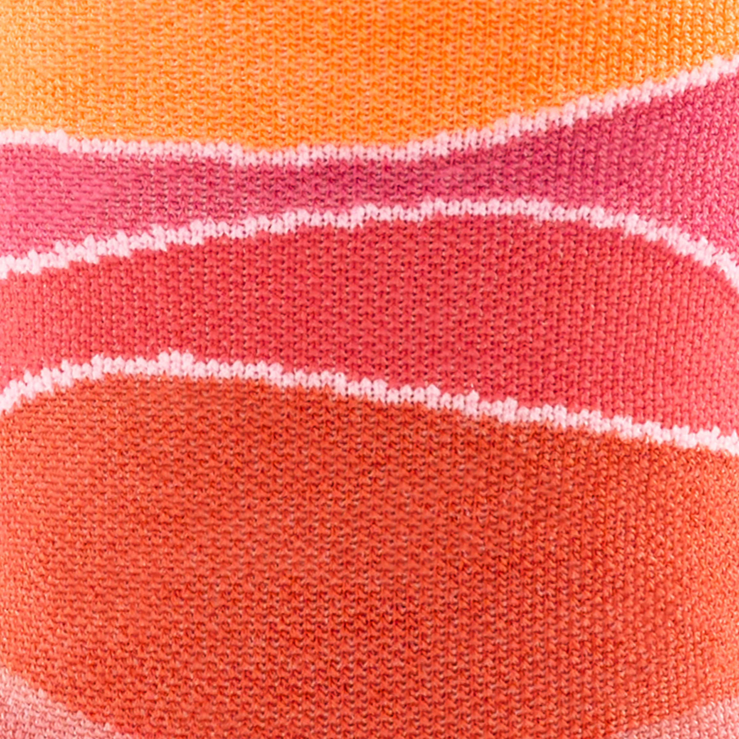 Call out detail image of the of the 1064 Canyon front side image of orange pink and peach wave lines