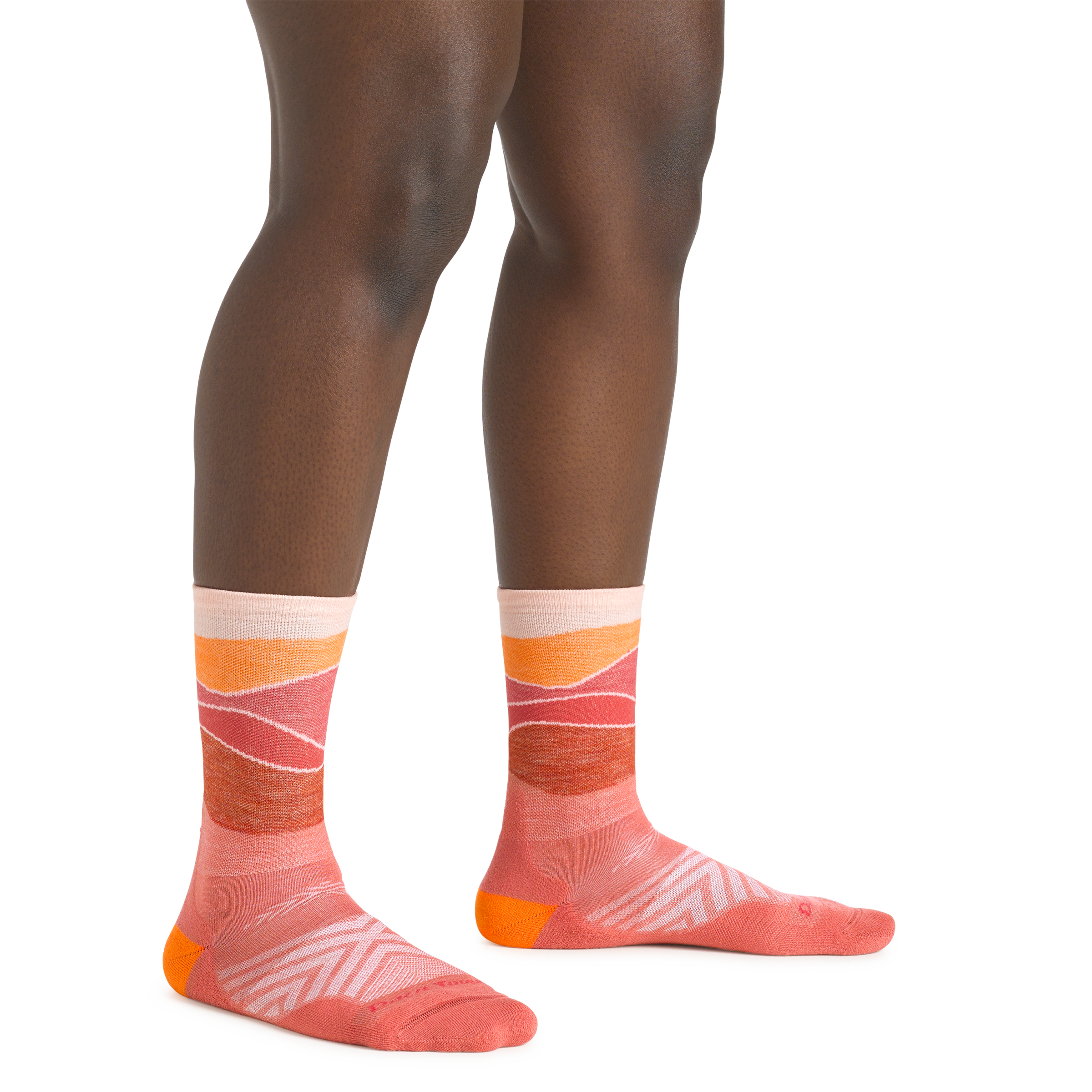 Close up shot of model wearing the women's horizon micro crew running sock in canyon color with no shoes on