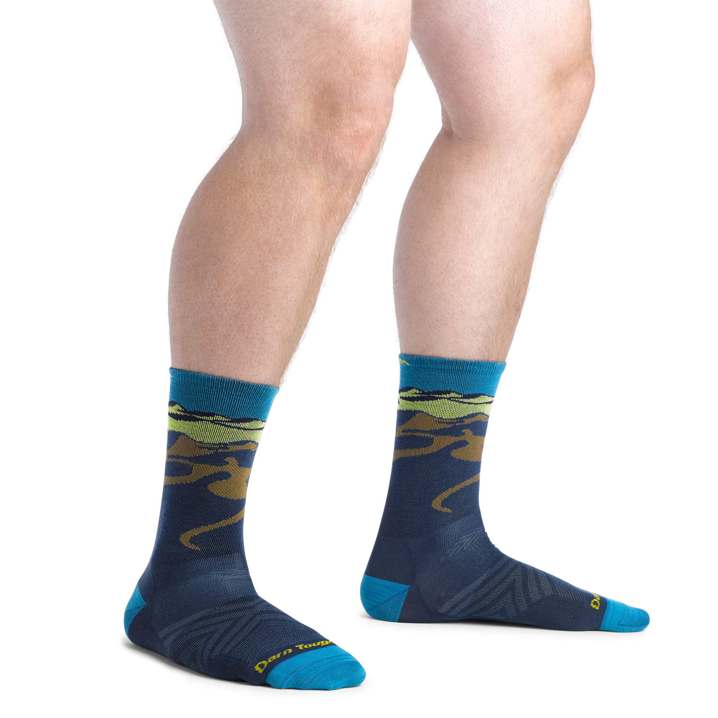 on model image standing feet apart wearing the 1065 midnight with navy body and mountain scene on cuff