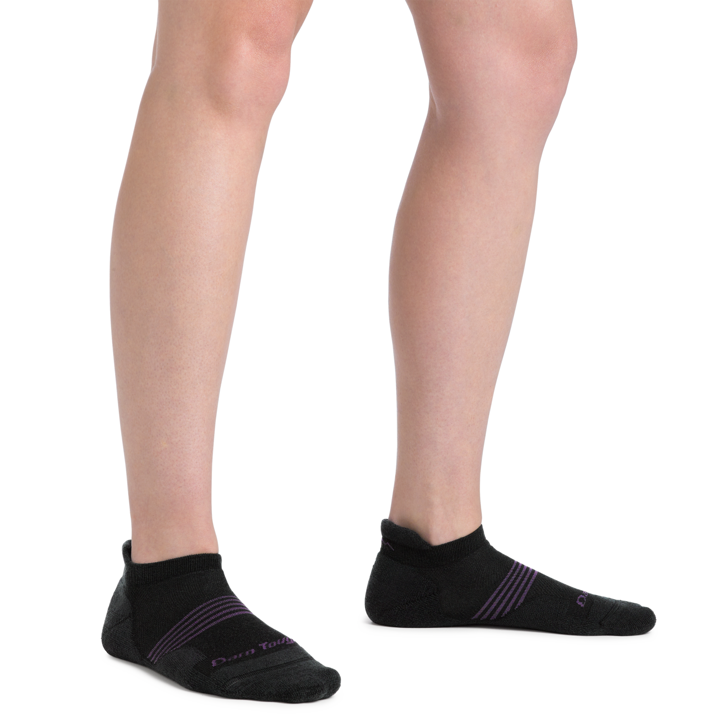 Close up shot of model wearing the women's element no show tab running sock in black with no shoes on