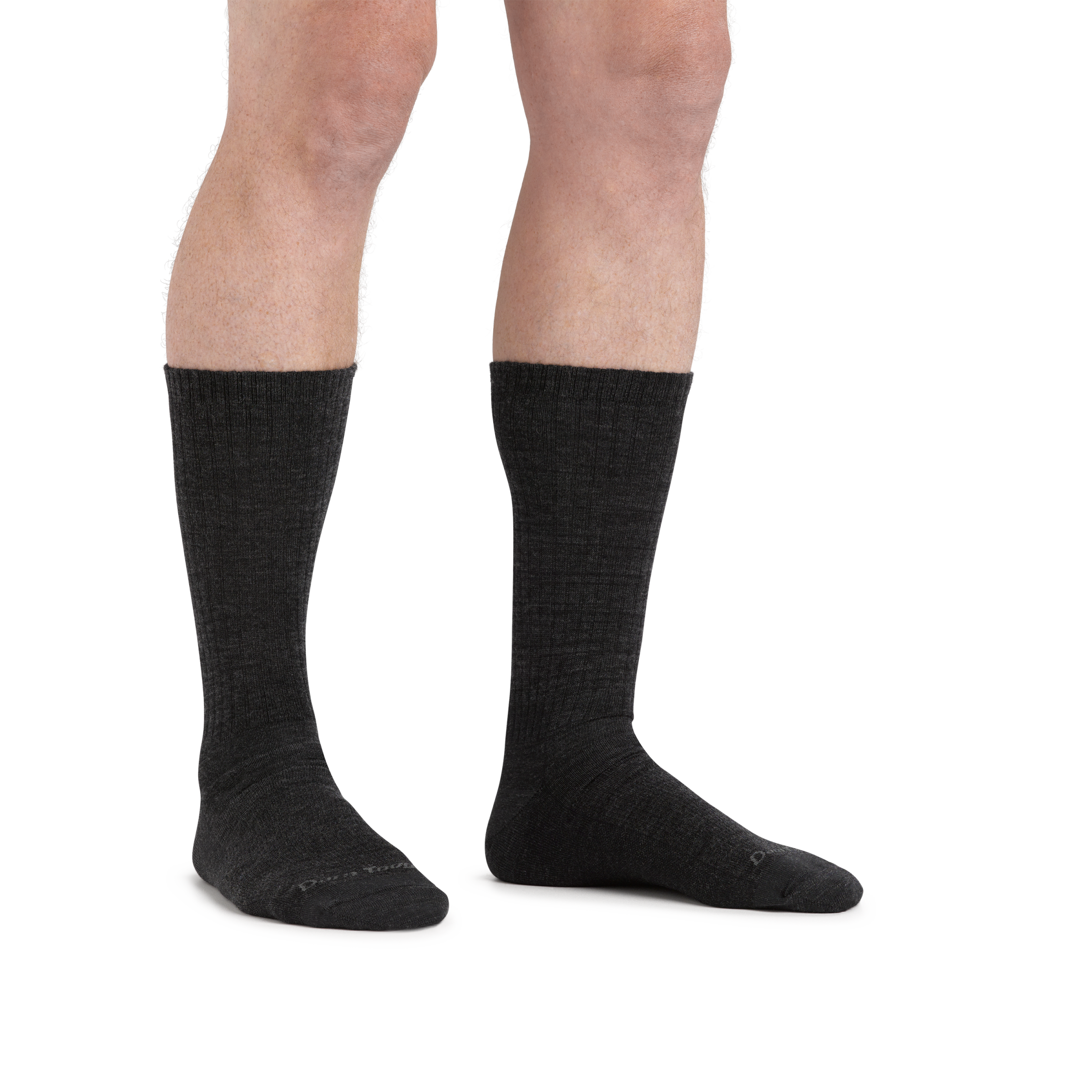 Man standing barefoot wearing The Standard Crew  Lightweight Lifestyle Sock in Charcoal