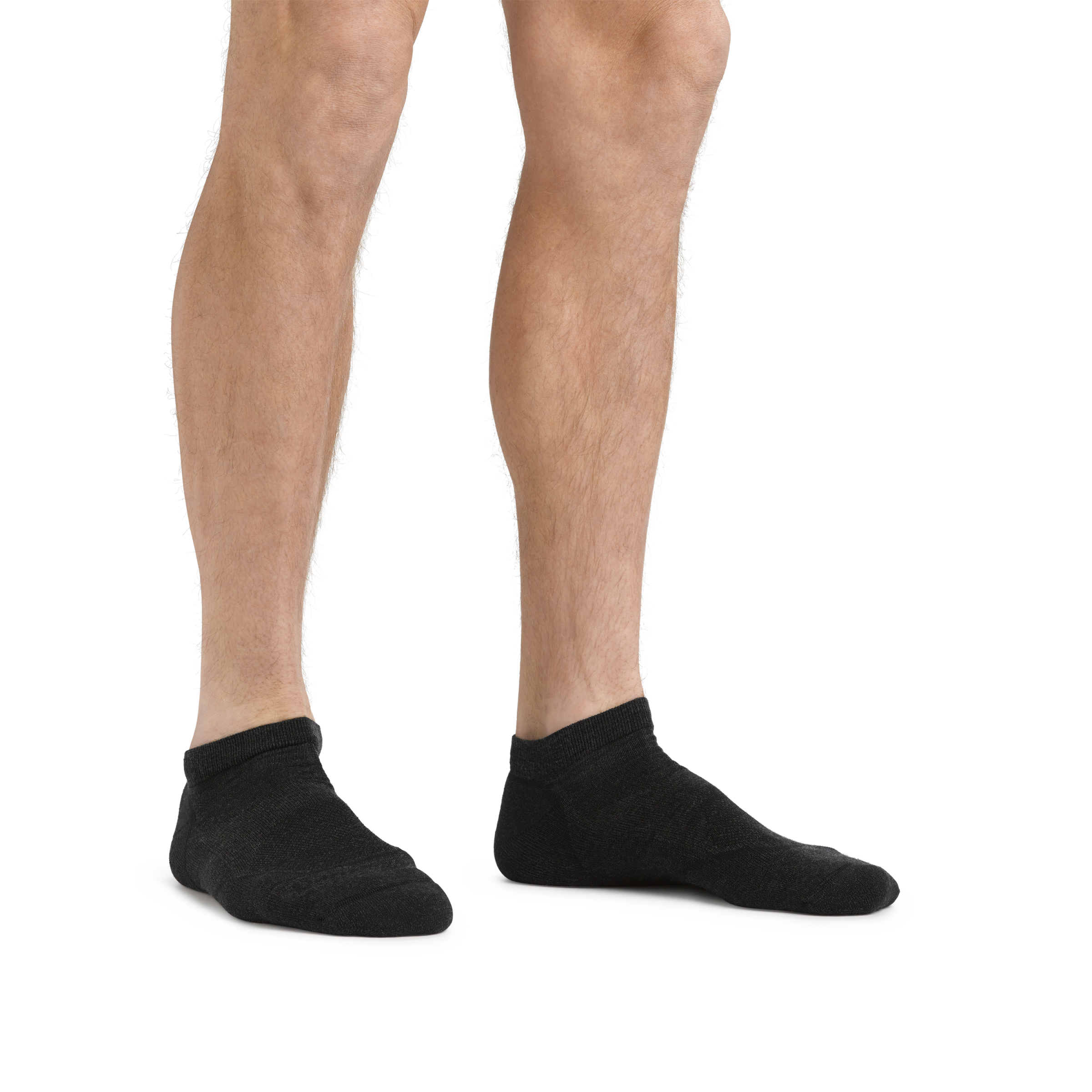 Man standing barefoot wearing Light Hiker No Show Lightweight Hiking Socks in Black