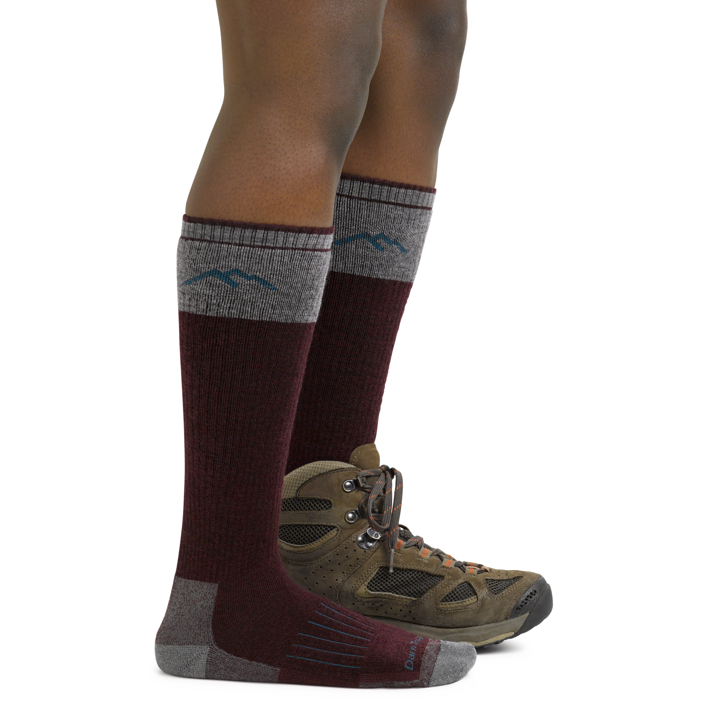 Women's Knee High Hunting Socks in Burgundy on foot with hunting boots
