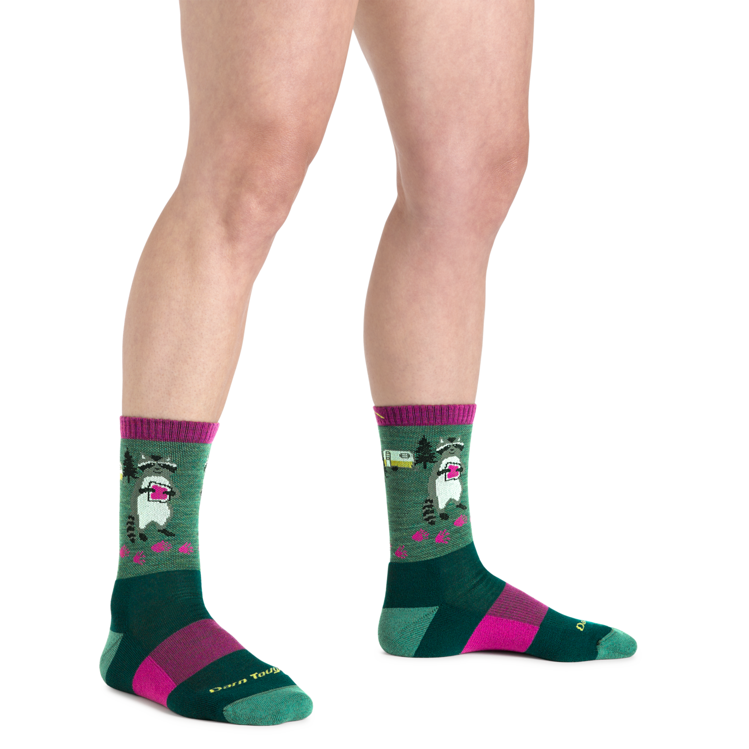 Close up shot of model wearing the women's critter club micro crew hiking sock in Moss green with no shoes on
