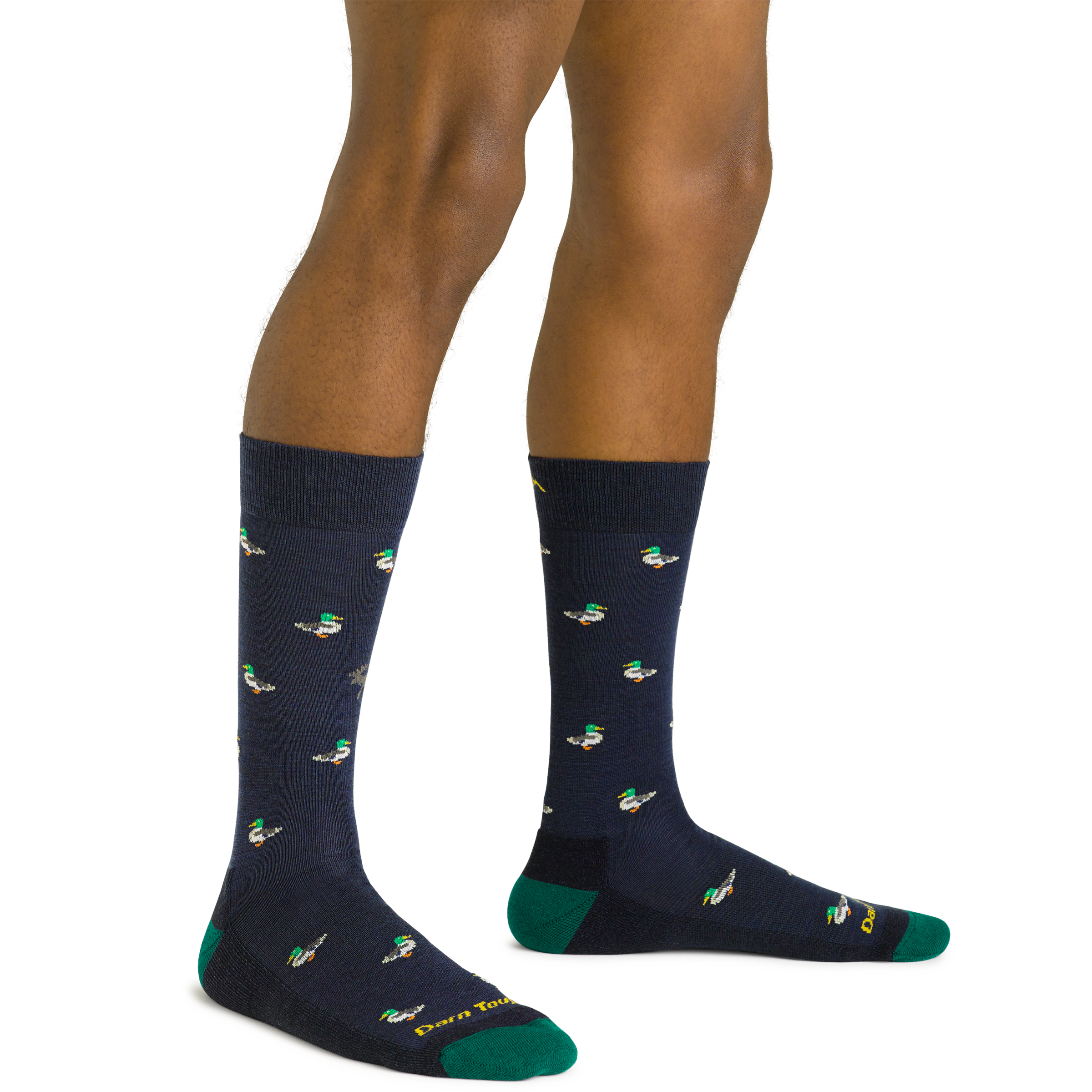 Side studio shot of model wearing men's duck duck moose crew lifestyle sock in navy eclipse