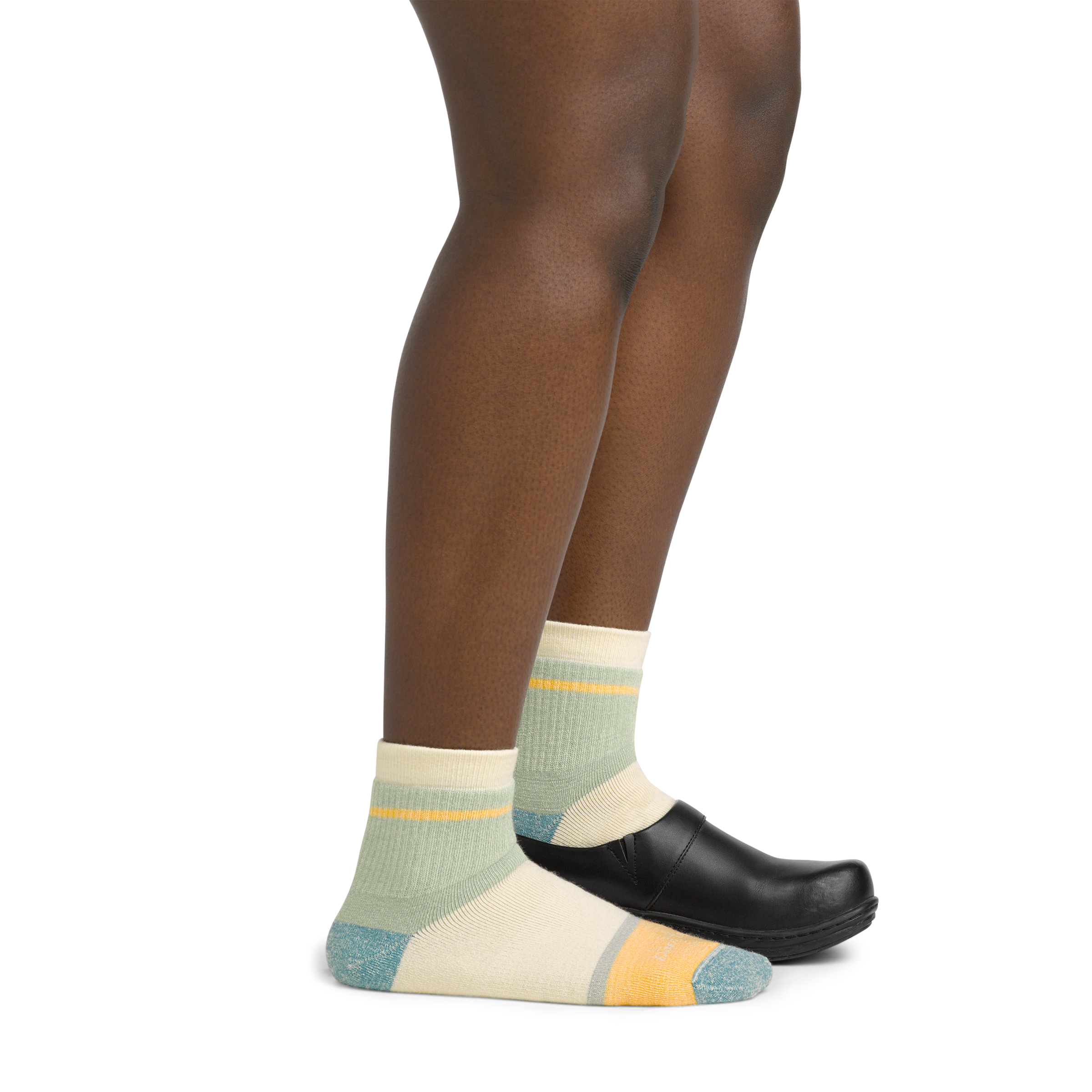 Image of model wearing 6117 Women's Shorty socks and a black clog on one foot