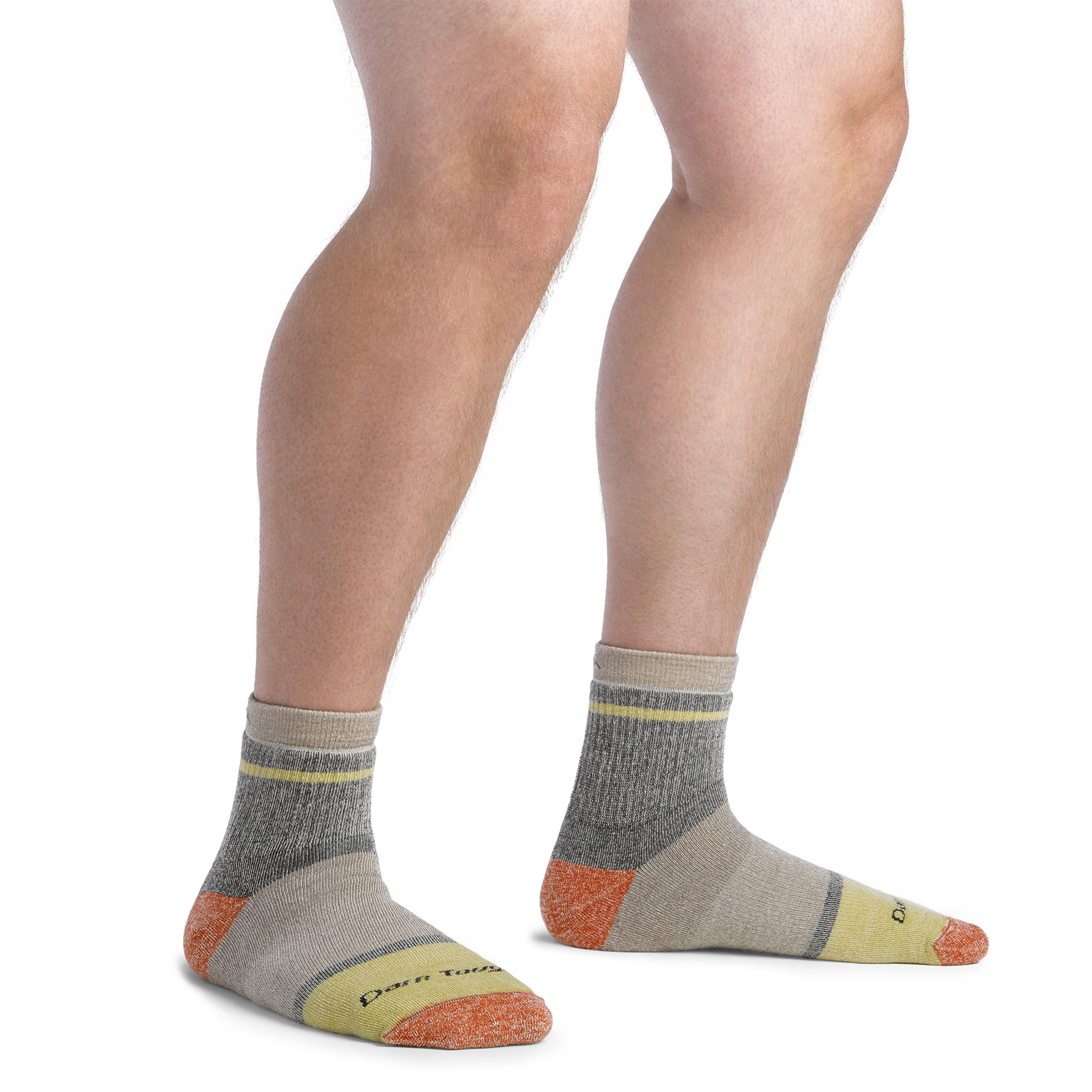 On model image of 6118 Men's Shorty socks in Rye colorway featuring tan, yellow, and orange accents