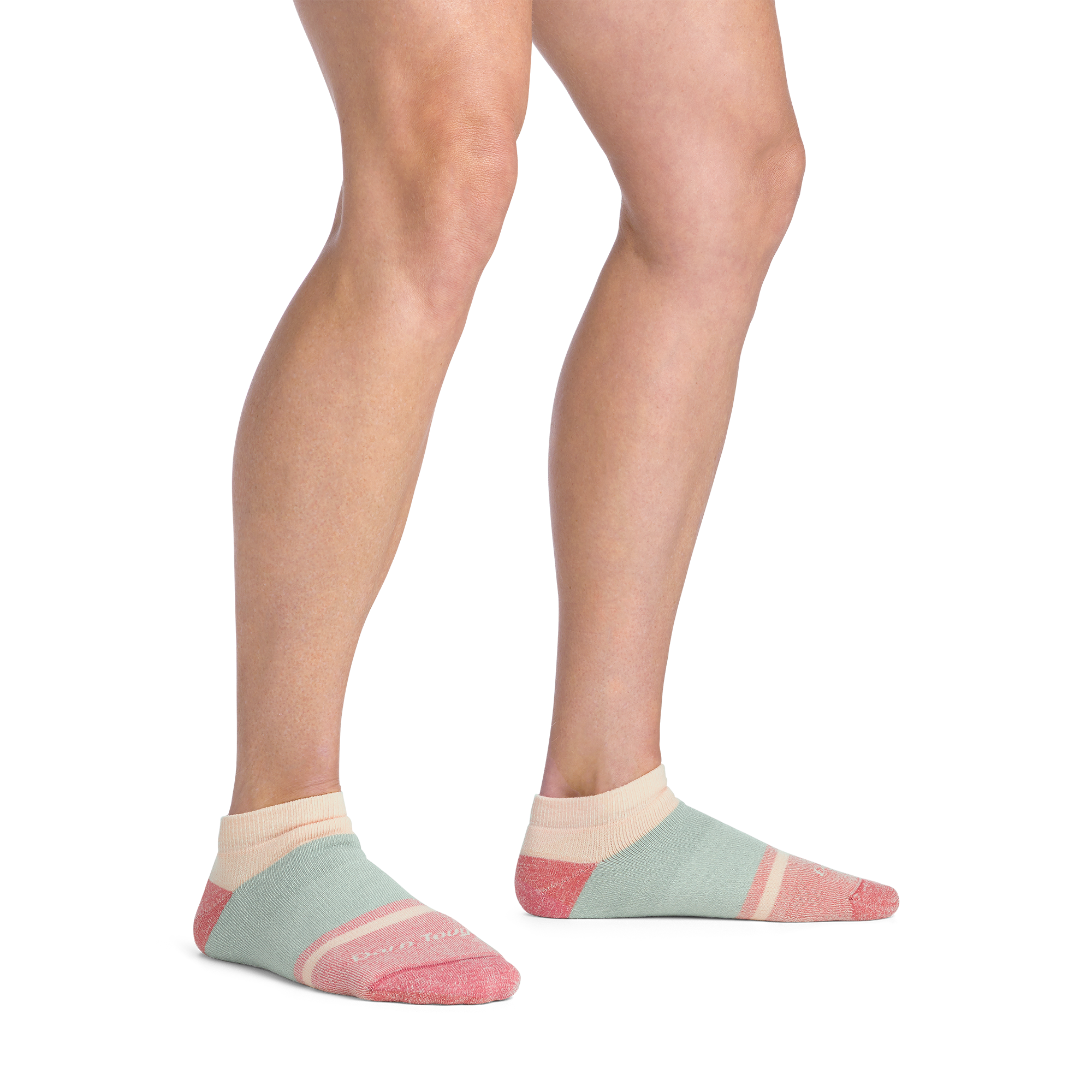 on model image bare foot wearing the 6127 no show lifestyle sock in honeydew colorway