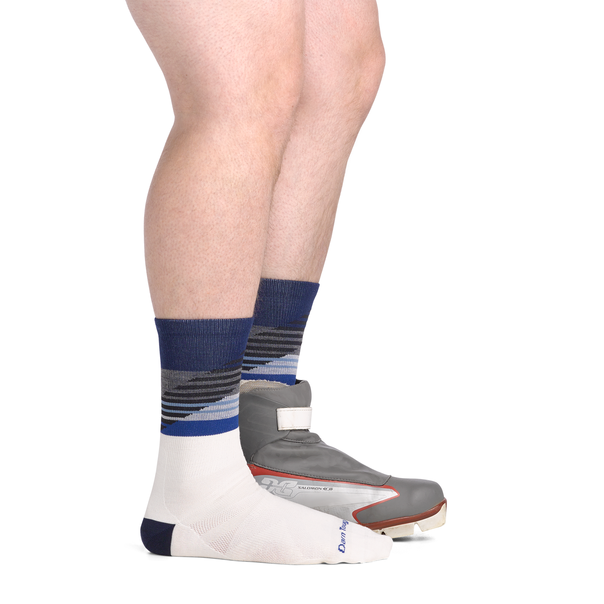 on model side view back foot in nordic boot wearing the 8032 lillehammer nordic boot sock in white colorway