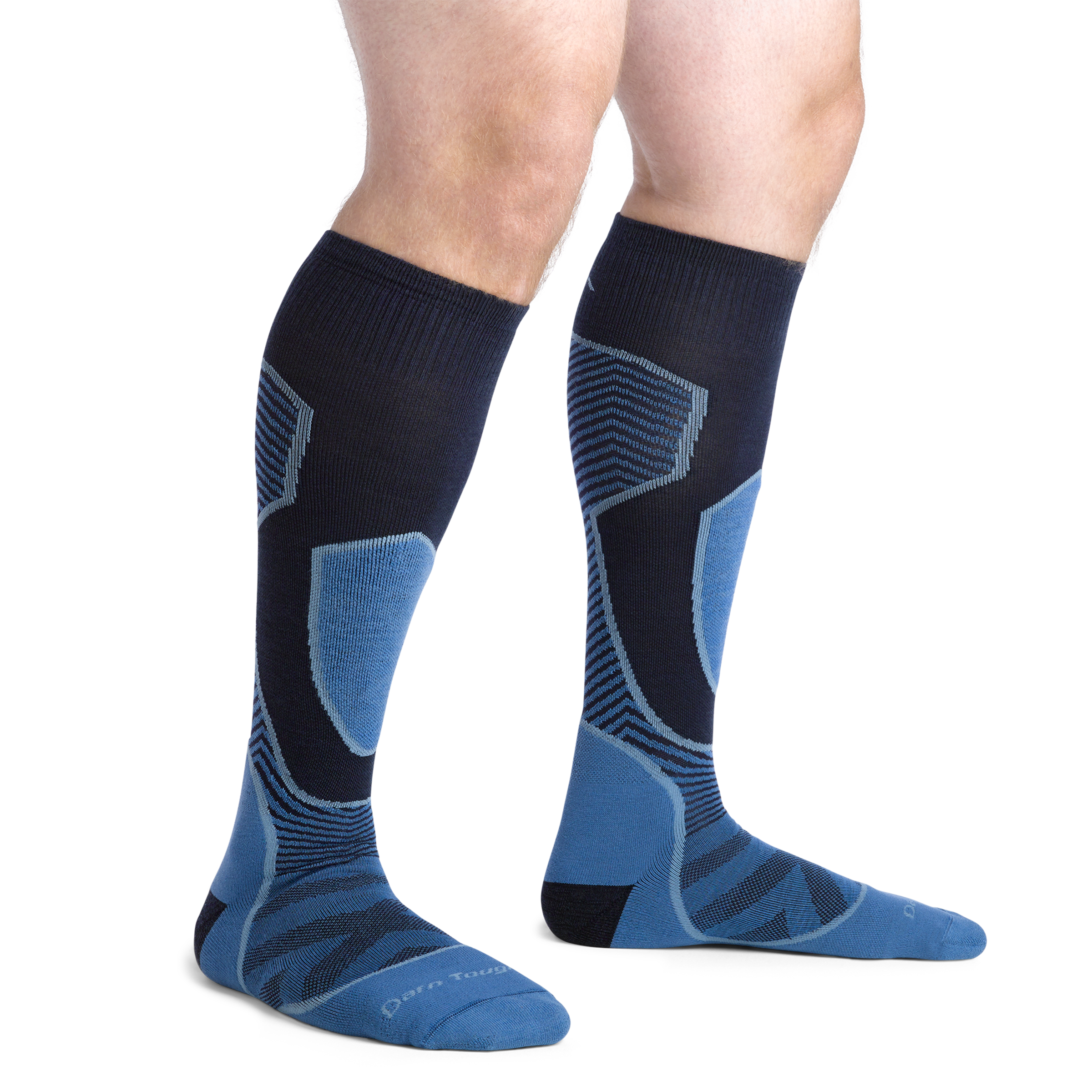 Man standing without shoes wearing Outer Limits Over the Calf Ski & Snowboard in Cobalt