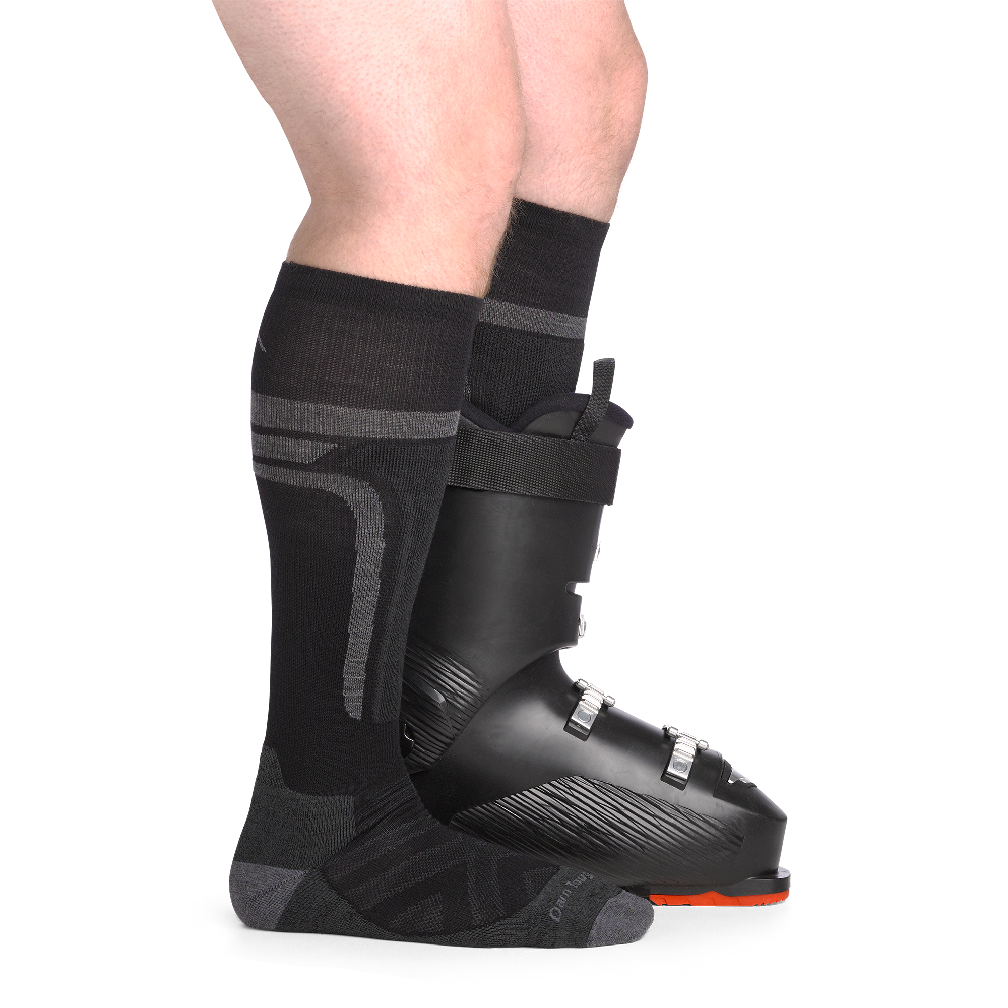 on model image side view back foot in boot wearing the 8053 edge over the calf sock in black colorway