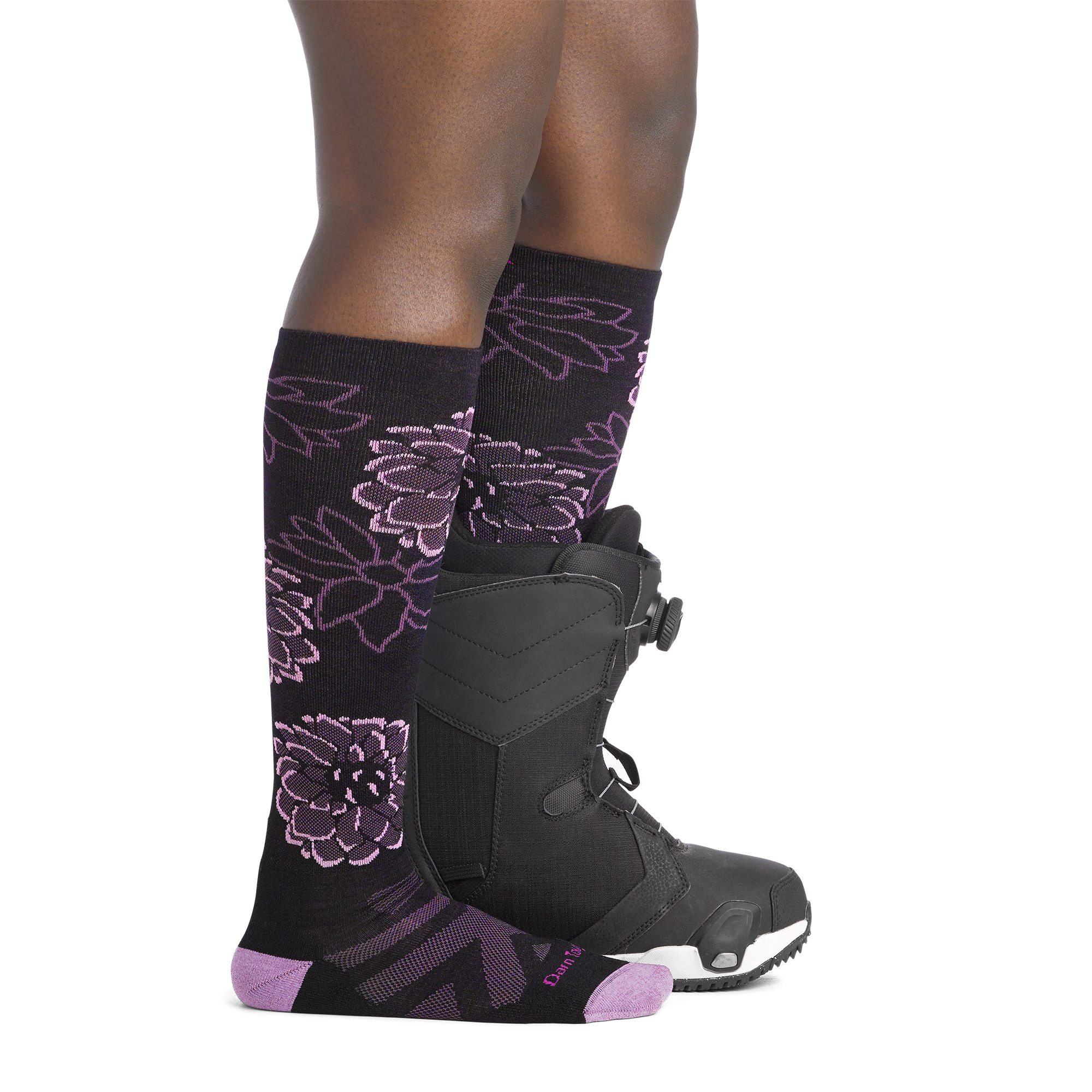 on model image side view back foot in boot wearing the 8056 dahlia over the calf sock in black colorway