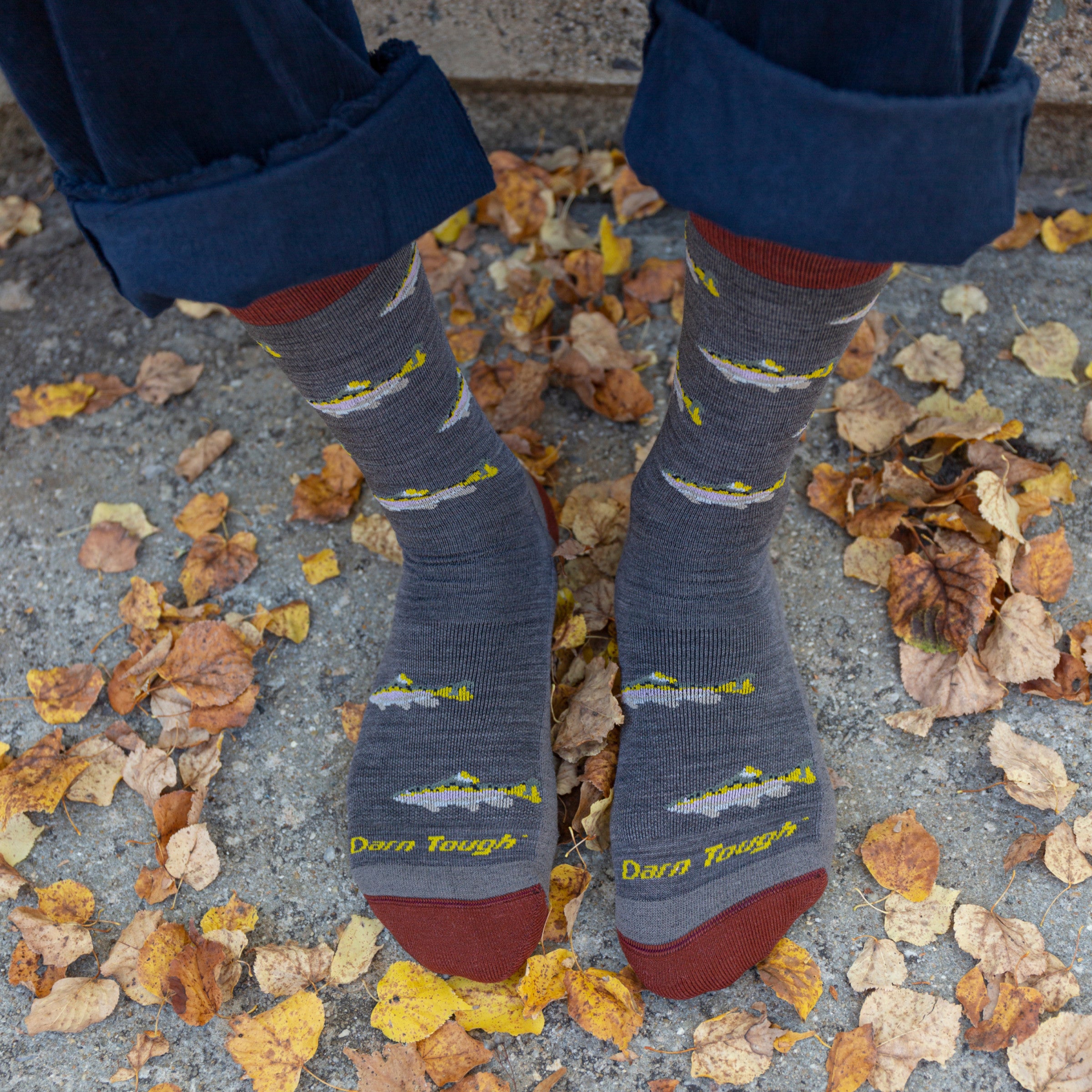 A closeup of feet wearing the men's spey fly everyday socks, perfect for fishermen