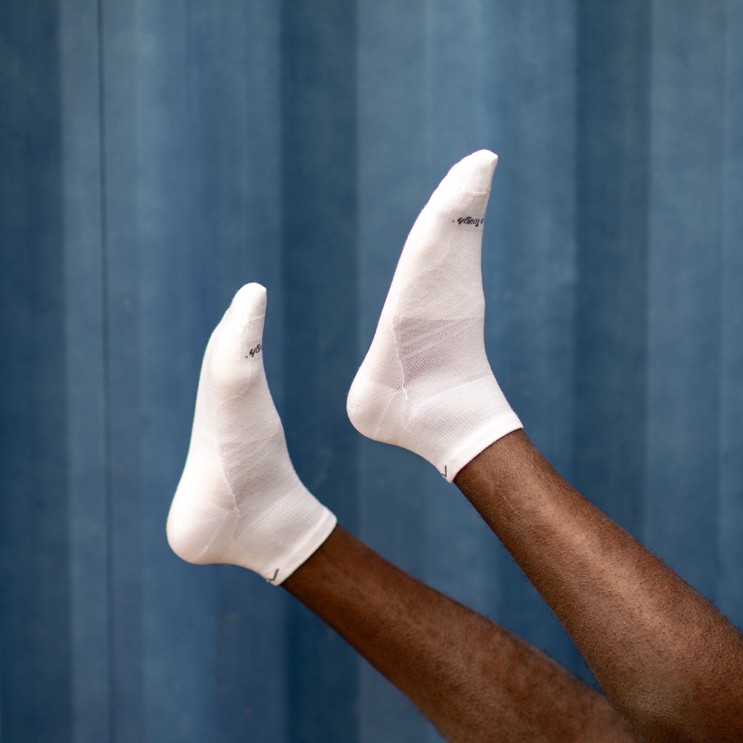 Man wearing Run Coolmax Quarter Socks in White Lifestyle Image