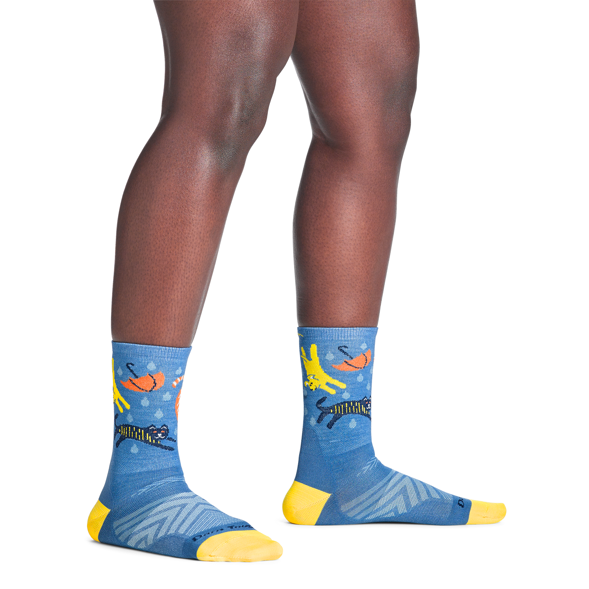 model standing barefoot wearing the 1070 ruff weather micro crew running sock in storm blue colorway