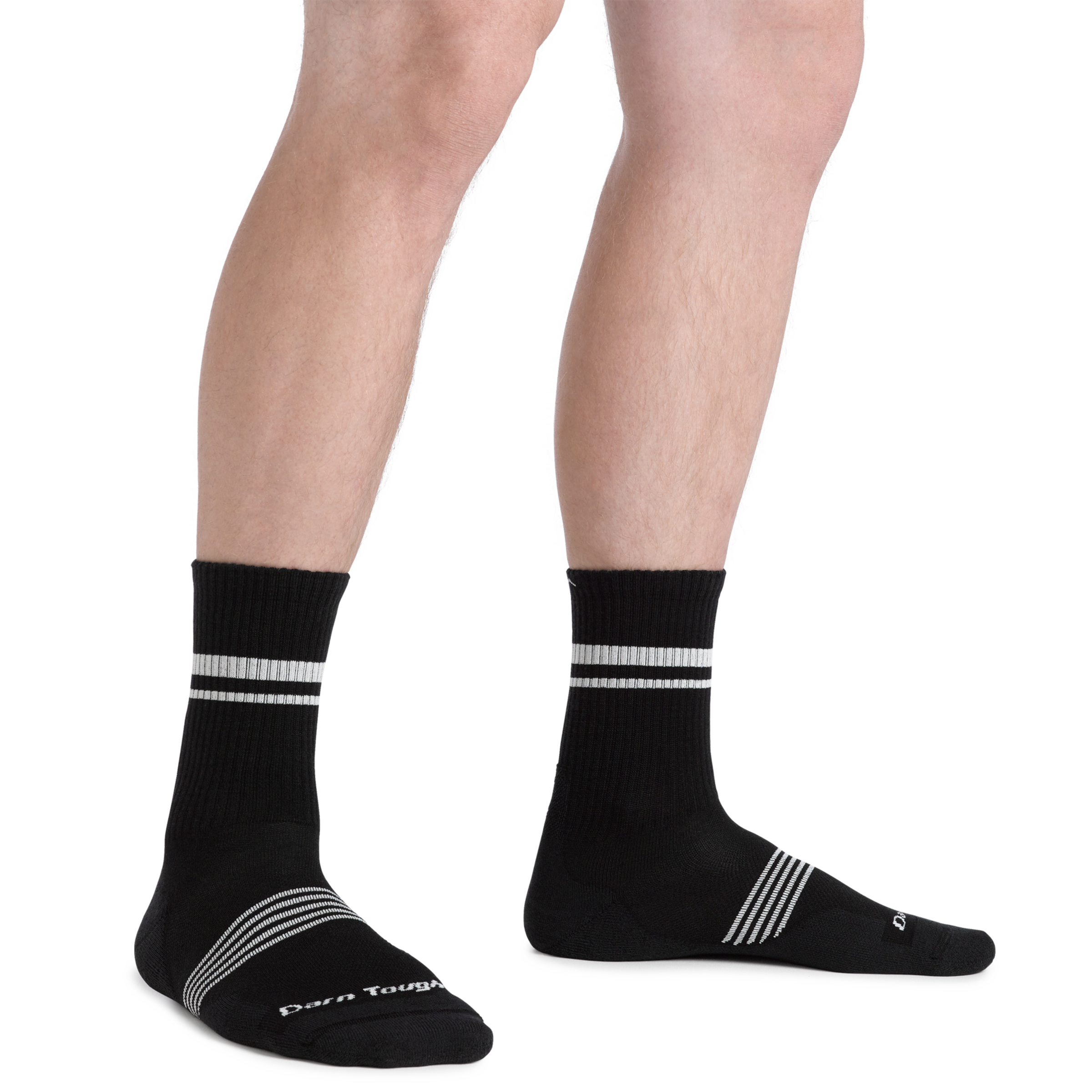 Close up shot of model wearing the men's element micro crew running sock in black with no shoes on