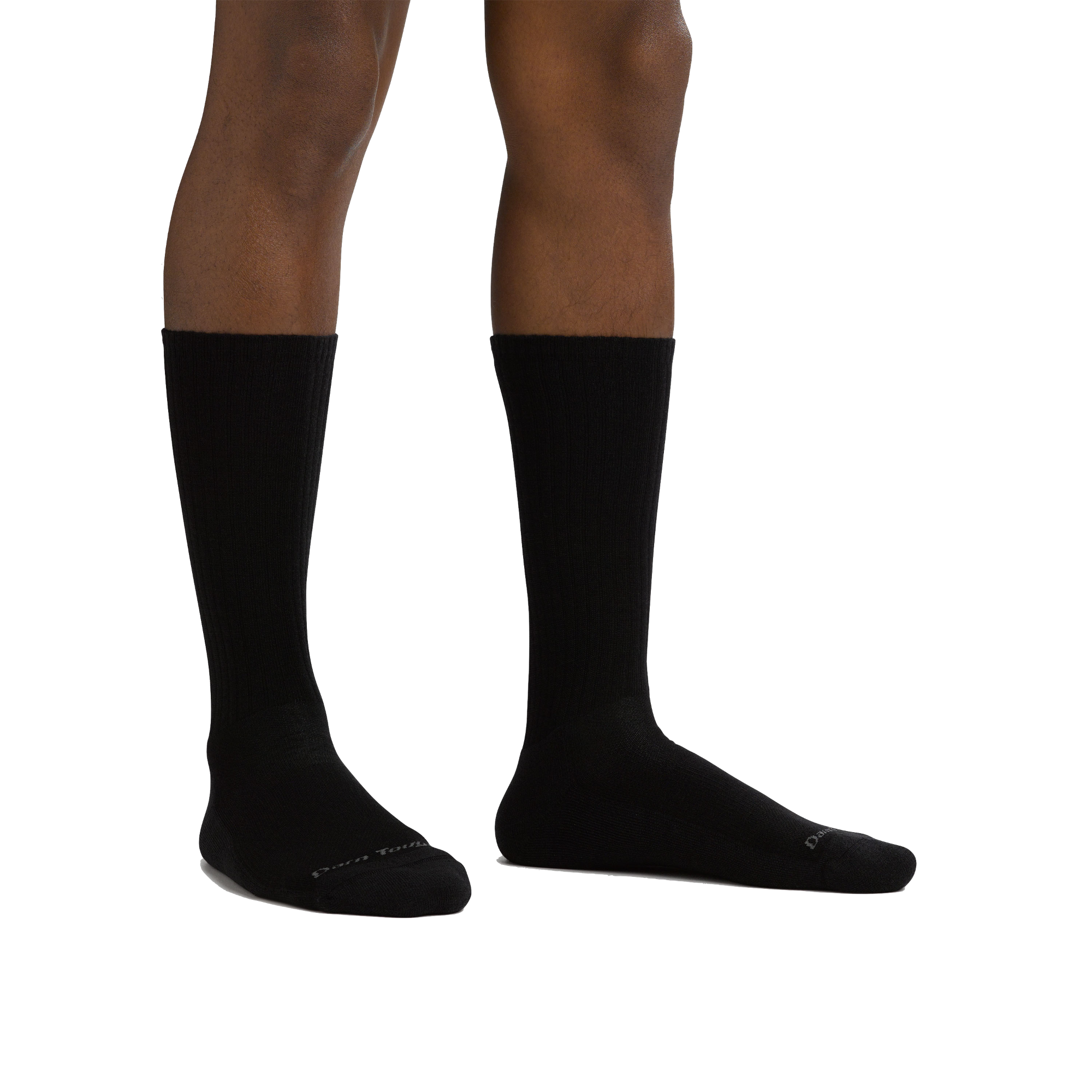 Studio shot of model wearing the men's the standard crew lifestyle sock in black with no shoes on