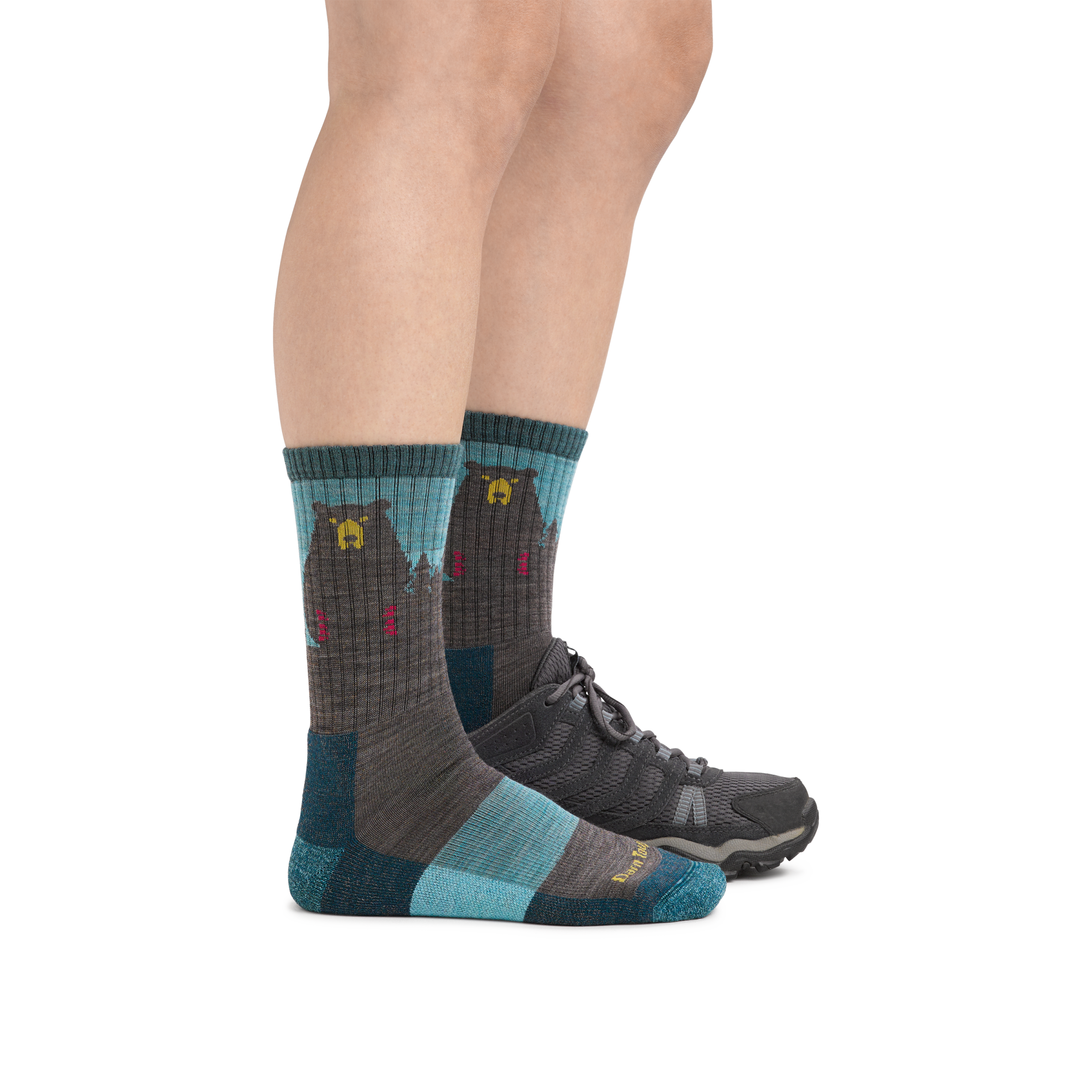 Woman wearing Women's Bear Town Micro Crew Lightweight Hiking Socks in Aqua with back foot also in a hiking shoe