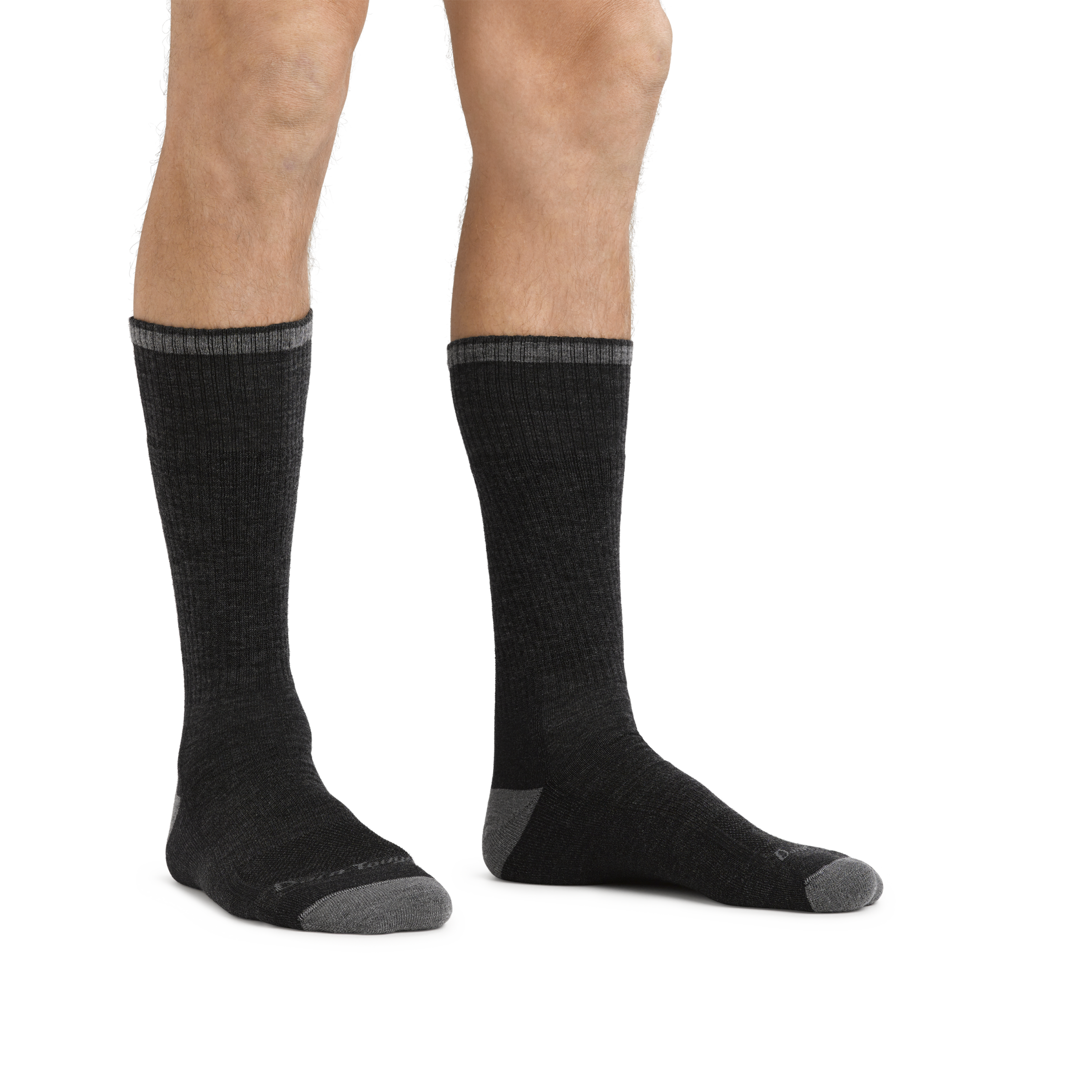 Man standing barefoot wearing John Henry Boot Midweight Work Sock in Gravel