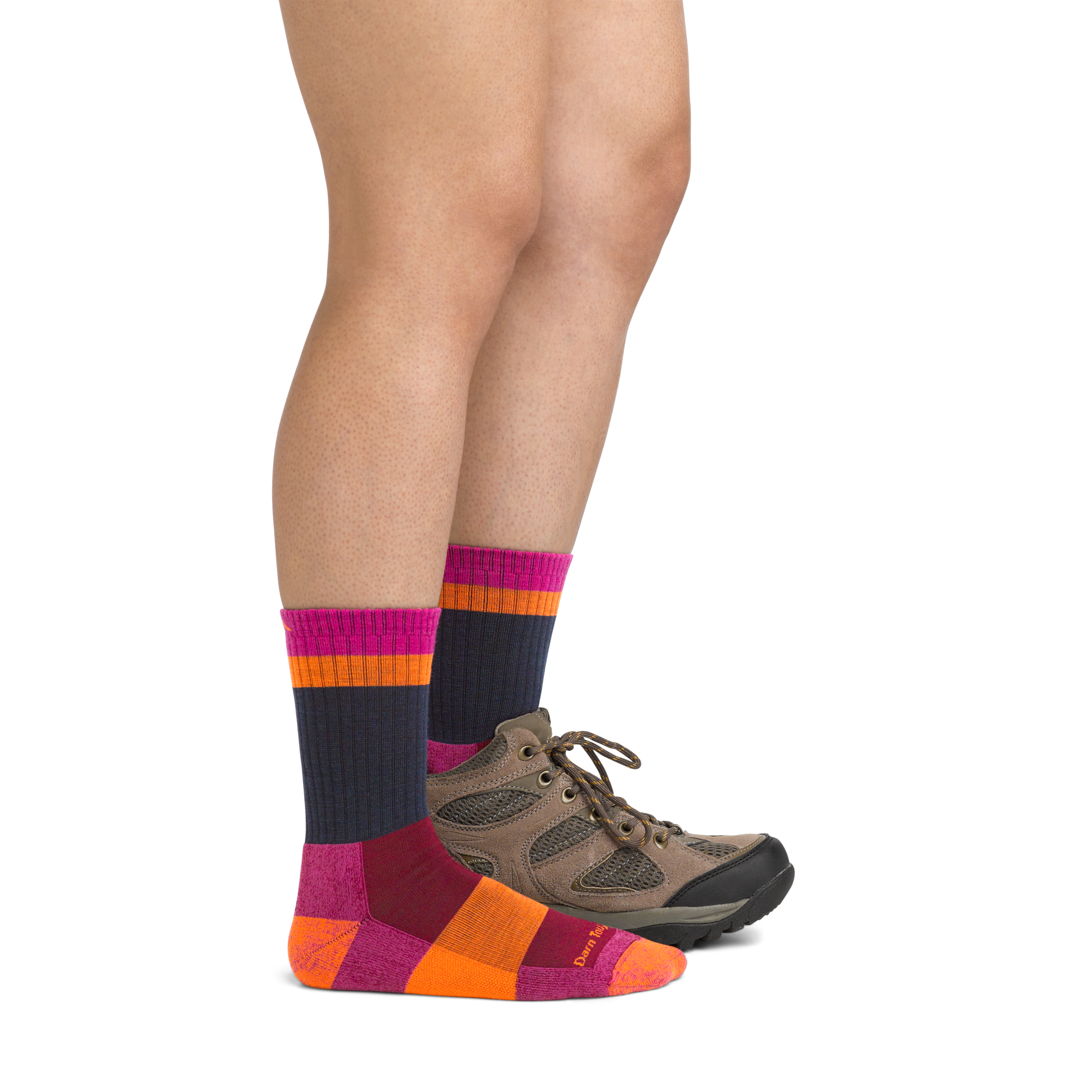 Image of model wearing 5018 Heady Betty Hiking Socks in Clover colorway and brown hiking boot on one foot