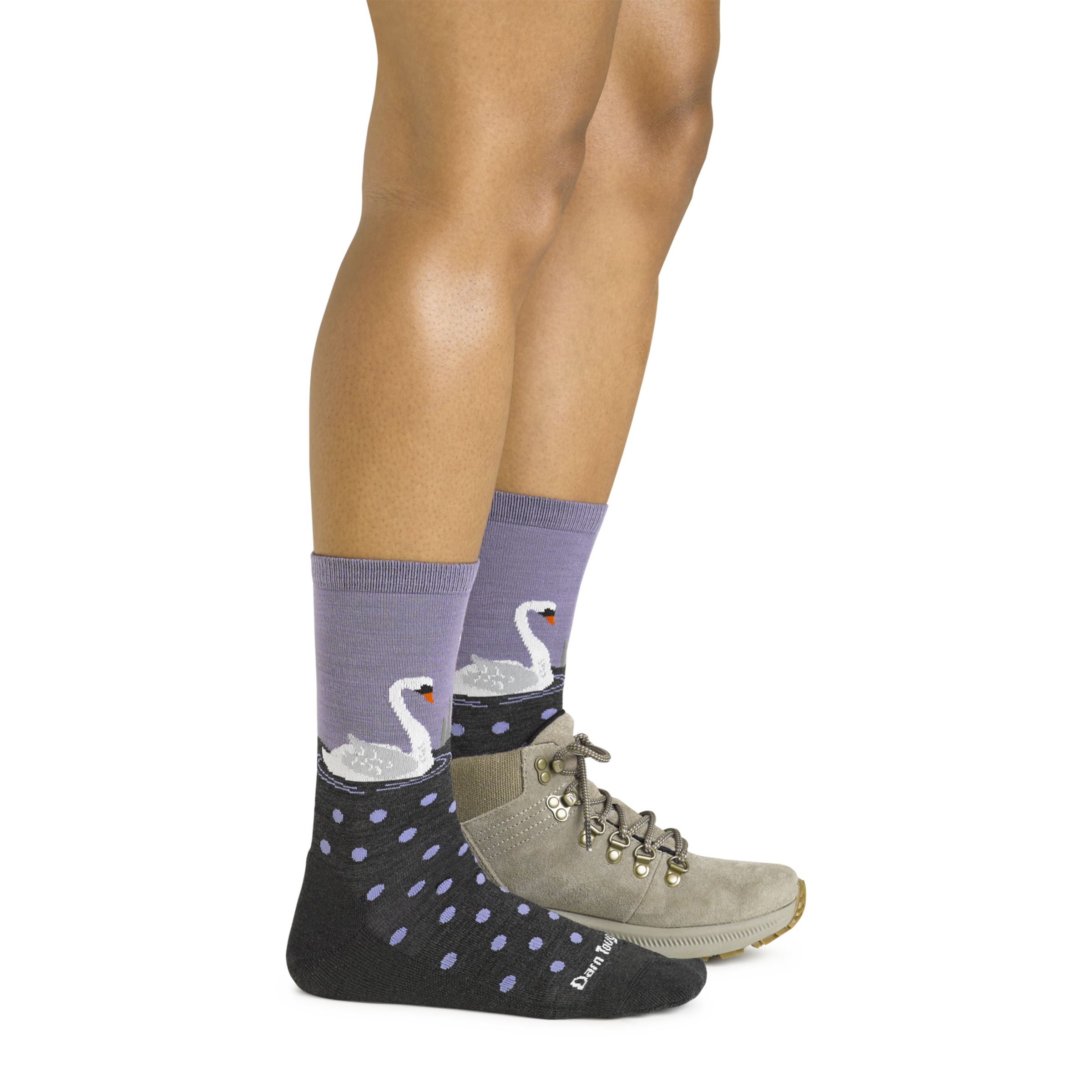 Side shot of model wearing the women's wild life crew lifestyle socks in charcoal with a gray boot on her left foot