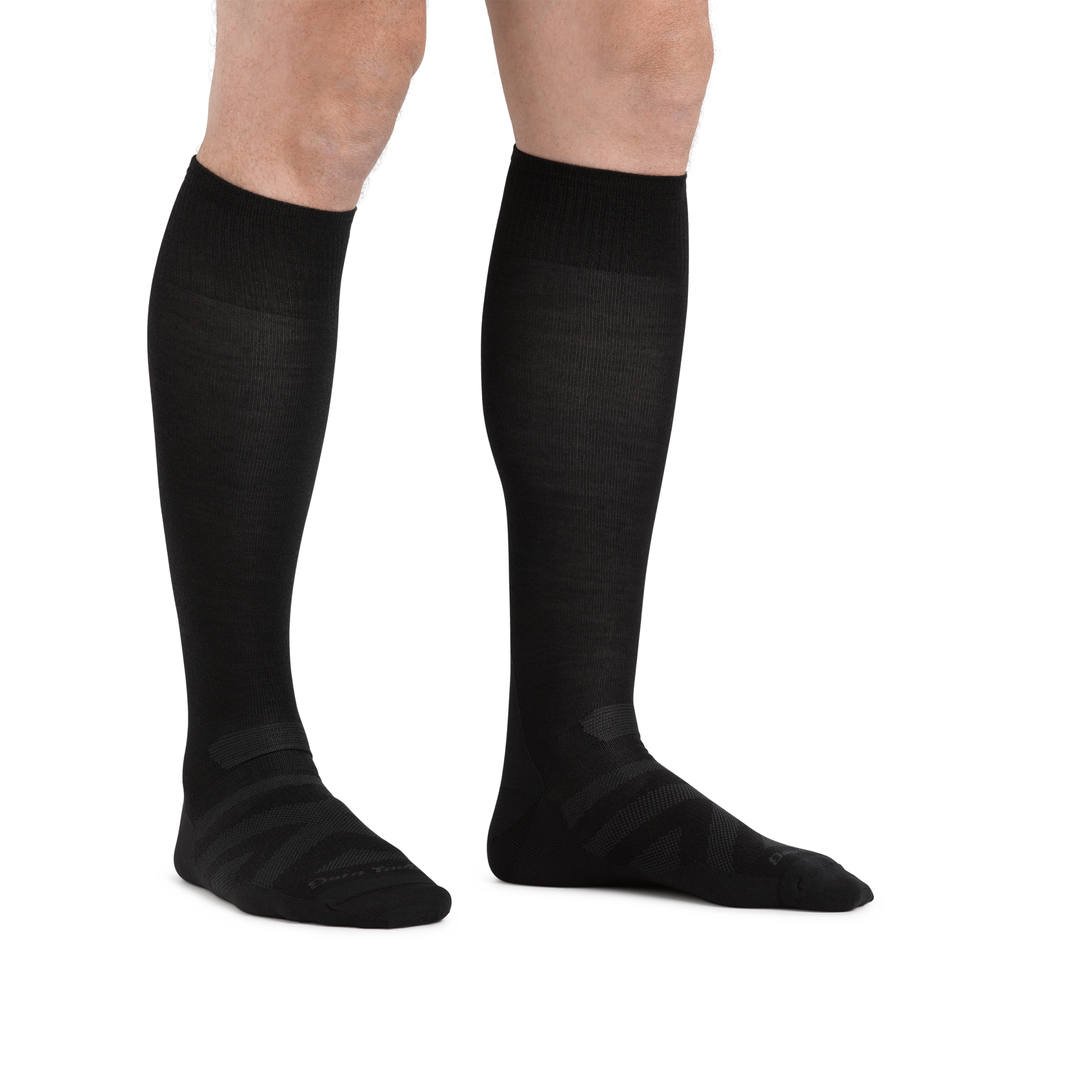 Man standing barefoot wearing RFL Over the Calf Ultralightweight Ski & Snowboard Sock in Black