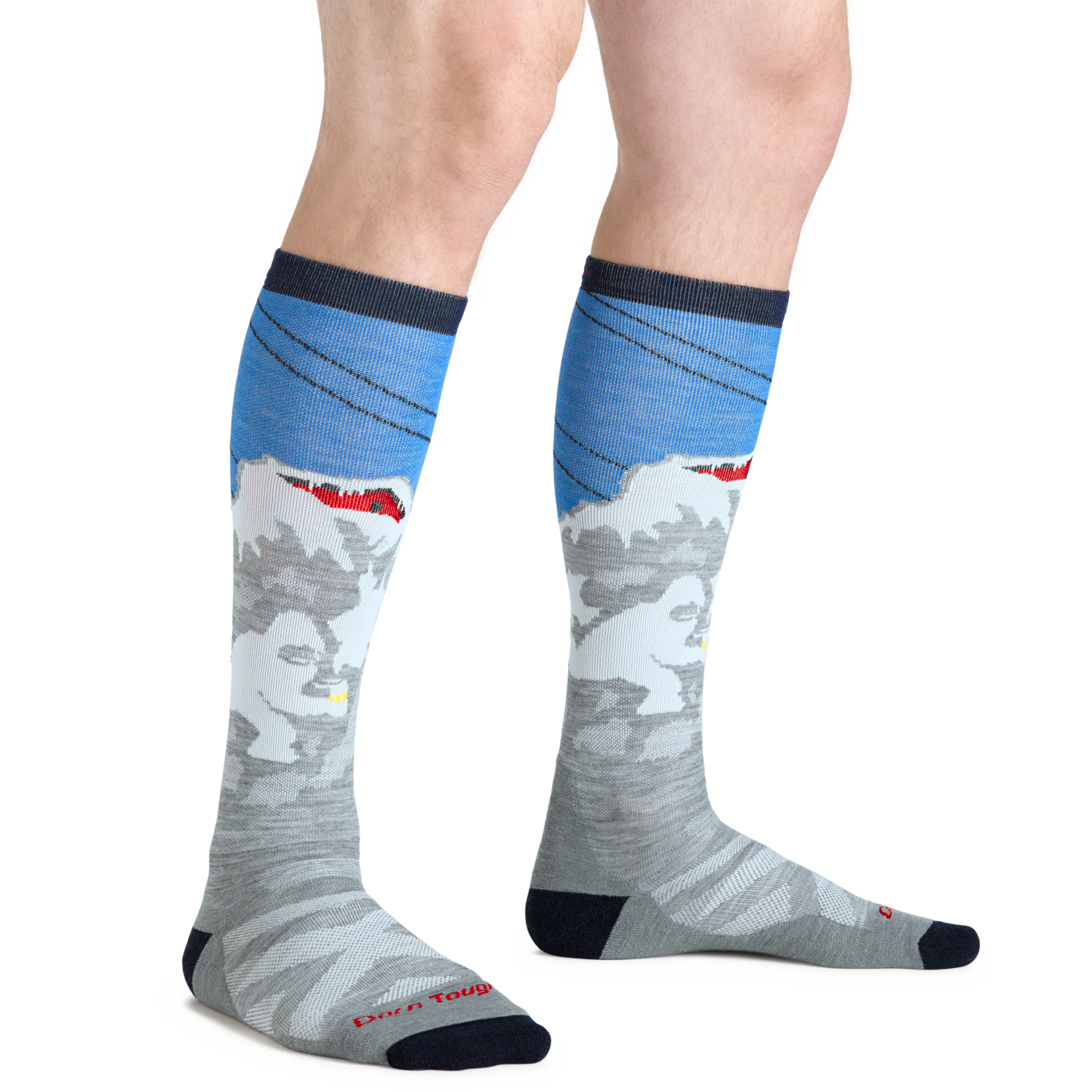 Man standing barefoot wearing Heady Yeti Over the Calf Ski & Snowboard Socks in Gray