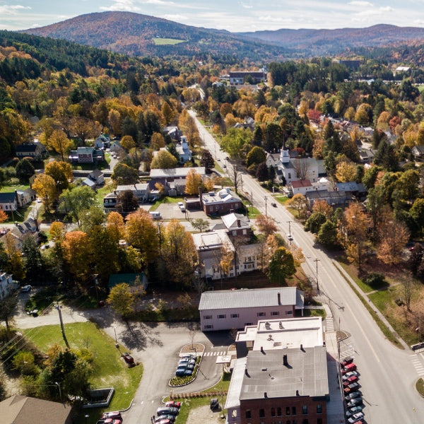 Aerial shot of Northfield, Vermont, showing the homes and beautiful mountains