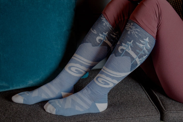 Shop Socks for Skiing & Snowboarding - feet wearing blue over the calf snow socks