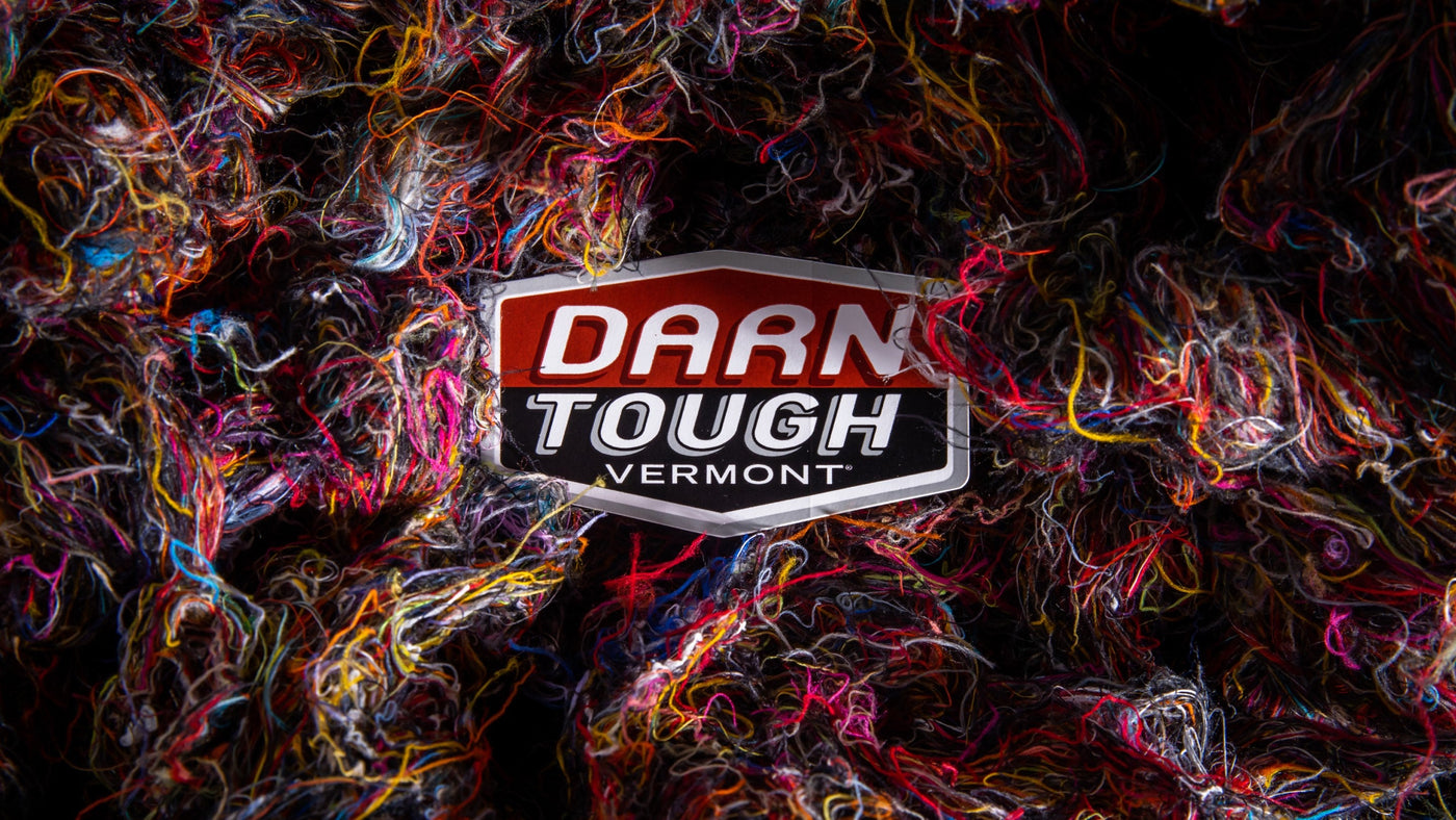 Darn Tough logo among Merino Wool fibers from making merino wool socks