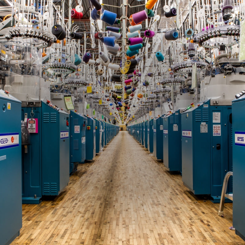 An aisle of knitting machines at the Darn Tough mill, where we knit the world's best socks