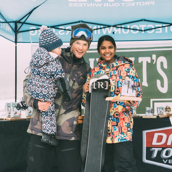 Professional Snowboarder Jake Blauvelt smiling with his family at a race event
