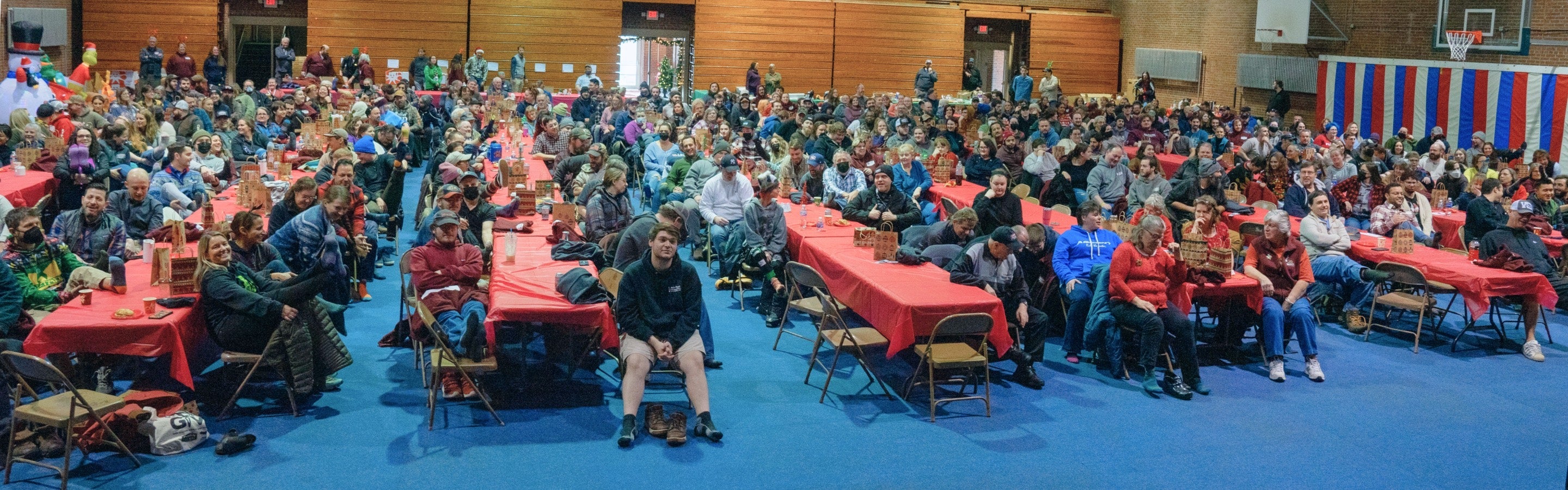 Every Darn Tough employee showing off their socks for a group photo at the holiday party