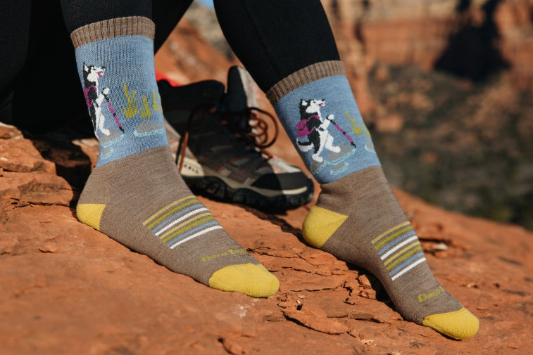 Shop Hiking Socks - feet wearing hiking socks with a husky dog design